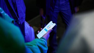 Person is looking at instant payments app on mobile device.