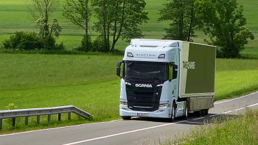 An electric vehicle from Traton Group (Scania) on the road.