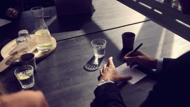 Hands of someone working by the desk